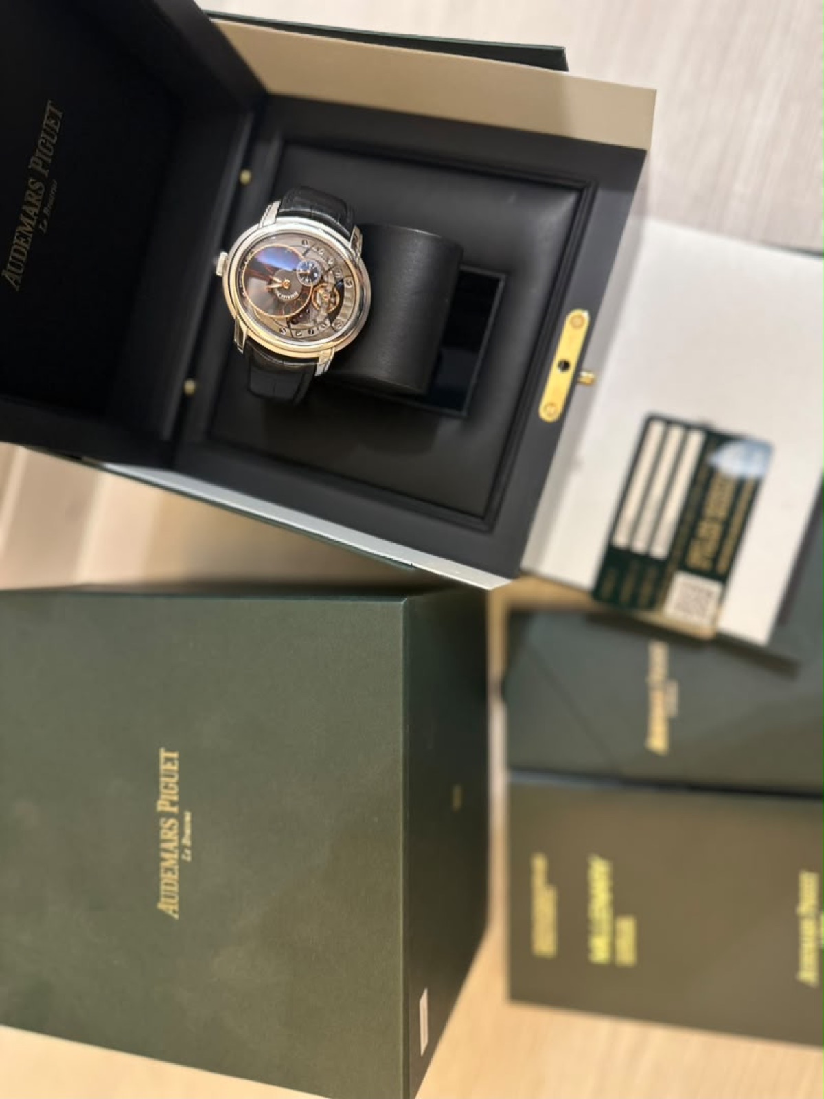 Audemars Piguet Millenary, complete with papers, held in hand