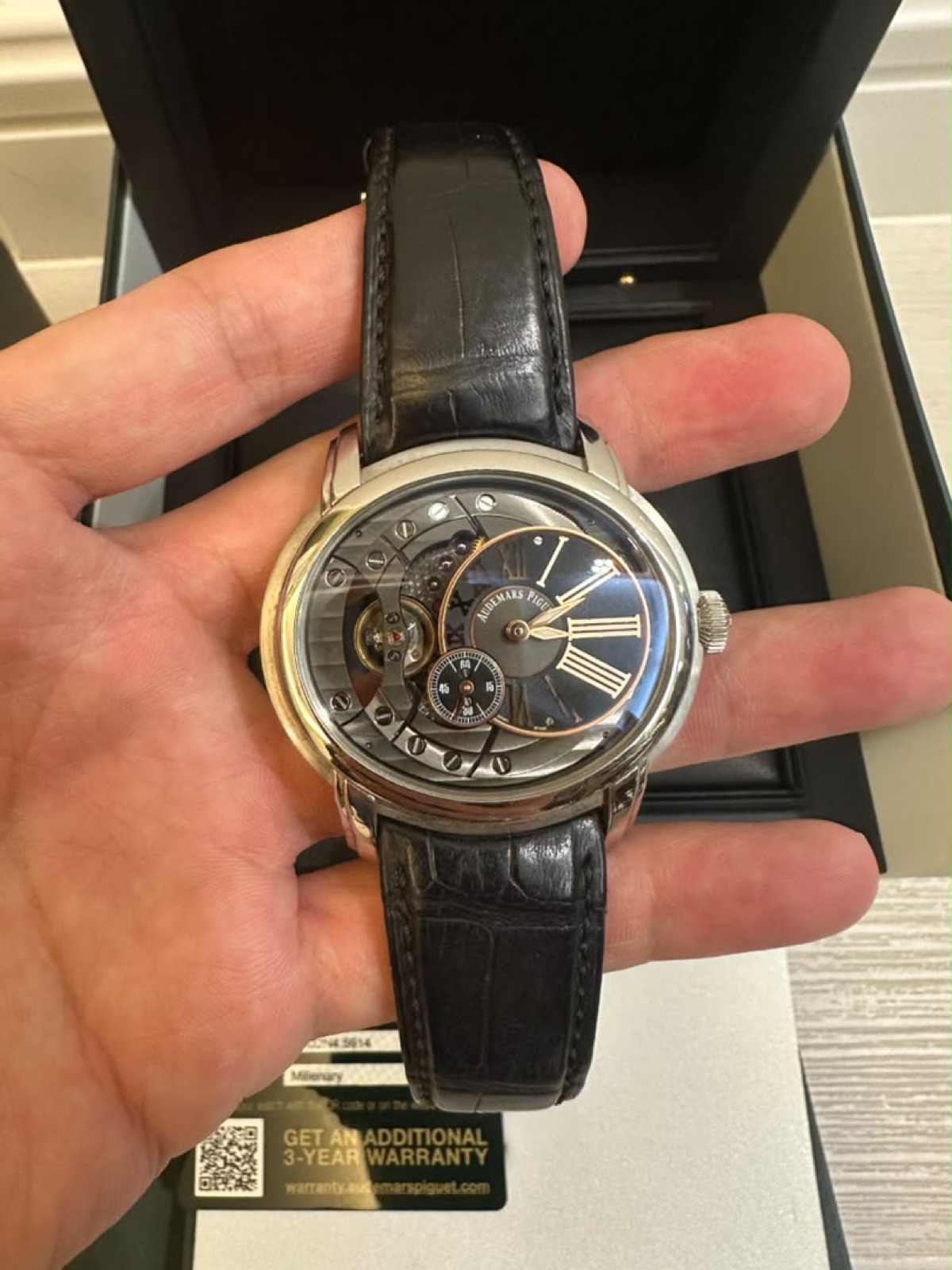 Audemars Piguet Millenary, open-worked dial, held in hand